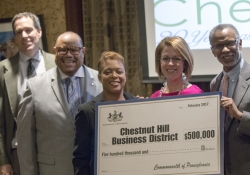 February 3, 2017: Senator Art Haywood presents the Chestnut Hill Business District with a check, made possible through a PA Department of Community and Economic Development grant program, that will go toward the improvement of pedestrian lighting and safety in the commercial corridor.